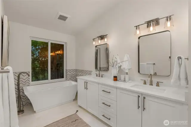 Primary ensuite features heated floors, double quartz vanity sink, a water closet and walk-in shower.