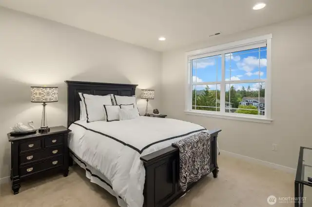 The second upstairs bedroom has its own private full bath.