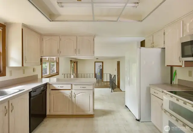 Kitchen looking into Breakfast Nook and Family Room
