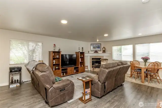 Beautiful laminate flooring flows through the downstairs.