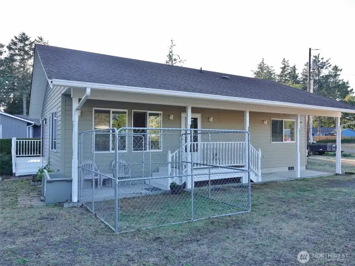 East-side of the house w/ fenced Dog Area.