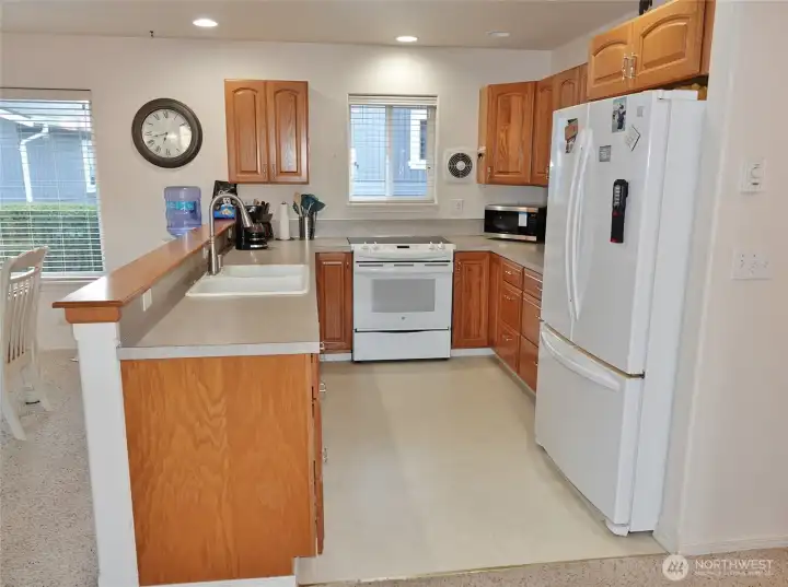 Kitchen w/ plenty of cabinet and counter space.
