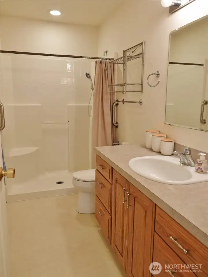 Bathroom w/ walk-in shower.