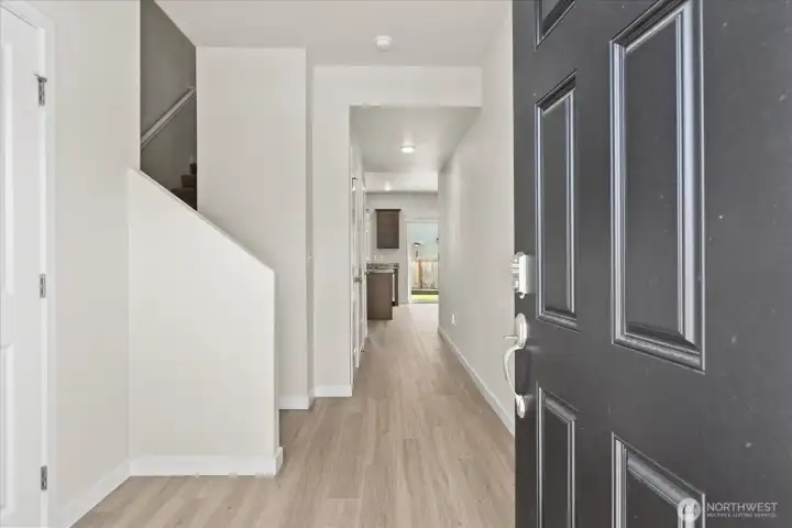 Enter this 2021 craftsman style home to an oversized entry way with luxury vinyl plank flooring.