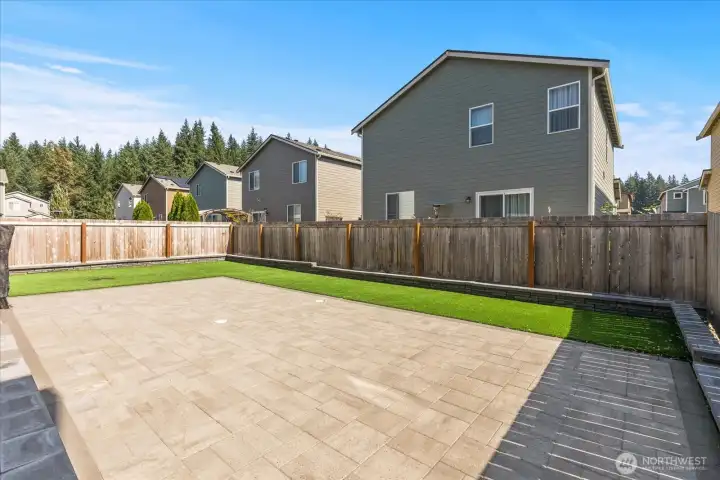 $17,000 in upgrades! Large stone patio and premium artificial turf.