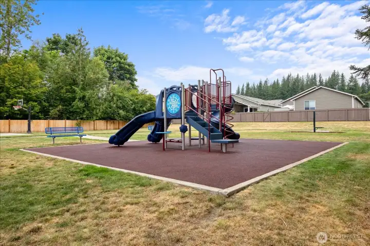 Neighborhood park with playground, featuring mountain views.