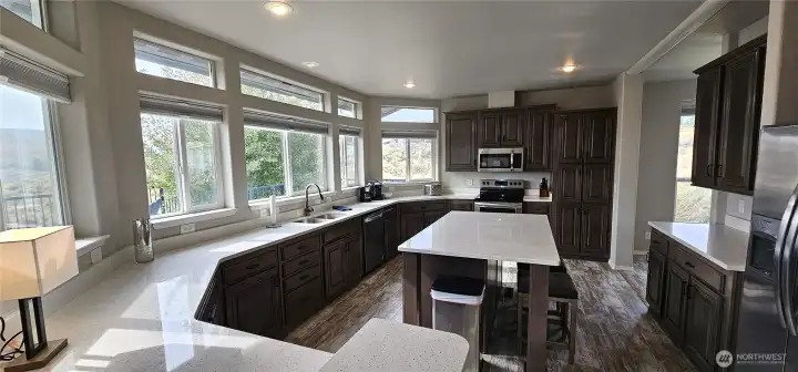 Lots of flow space, back counter and 2 eat at counter spaces.