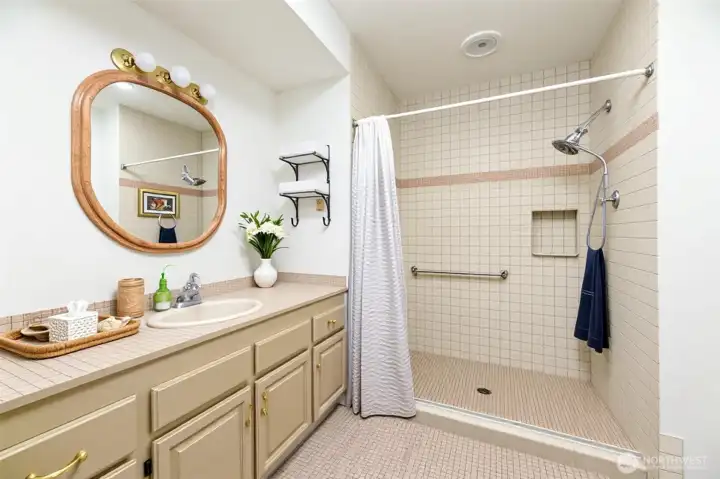 Main Level bath Primary bath*Virtually Enhanced* the shower has no lip at the shower floor( program added) and is all one level.