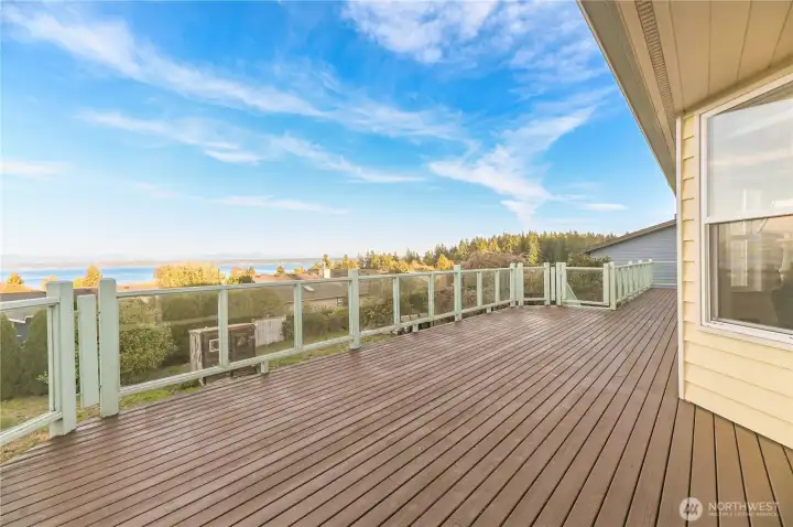 Large deck wraps all the way around to the other side of the home.