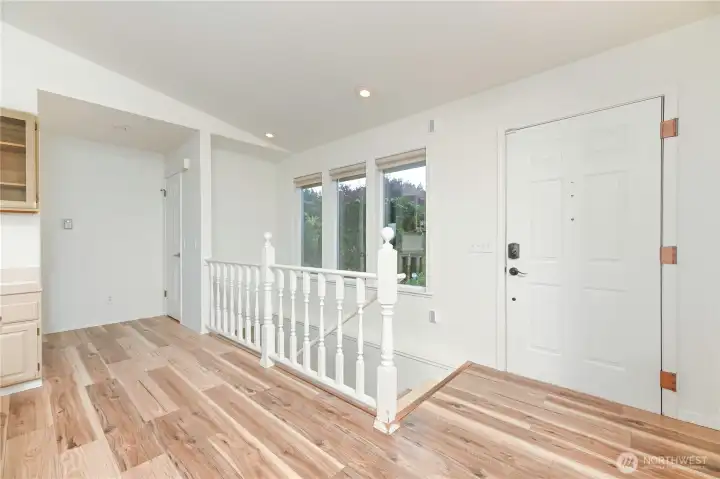 Main entry with accessibility sized entry door. Stairs to the lower level living.