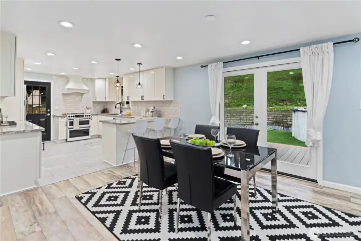 French doors open to the massive trex deck/pool/bbq - makes for great entertaining!