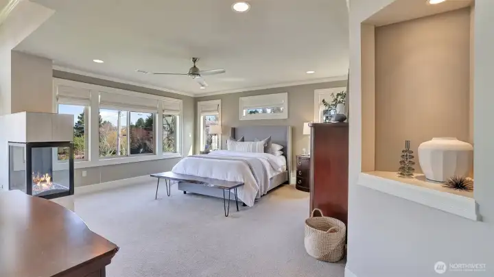 o Expansive primary suite  o Go to sleep with a view of the city lights and wake up to spectacular views of the lake and mountains.  o Cozy three-side gas fireplace.  o Sitting area  o Wired for TV and mount  o Large walk-in closet   o Spa-like primary bath and huge shower.   o Private balcony to take in the morning views with your cup of coffee