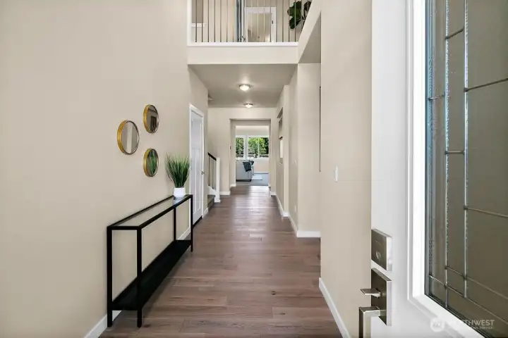 Formal entryway with hardwoods.