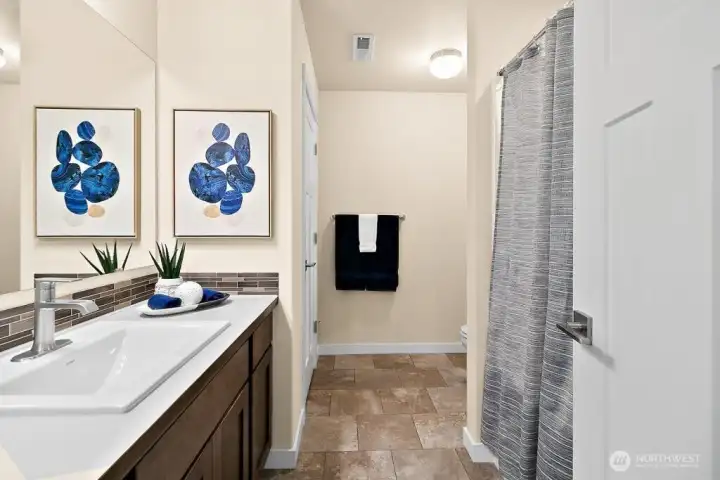 Upstairs bath with quartz.