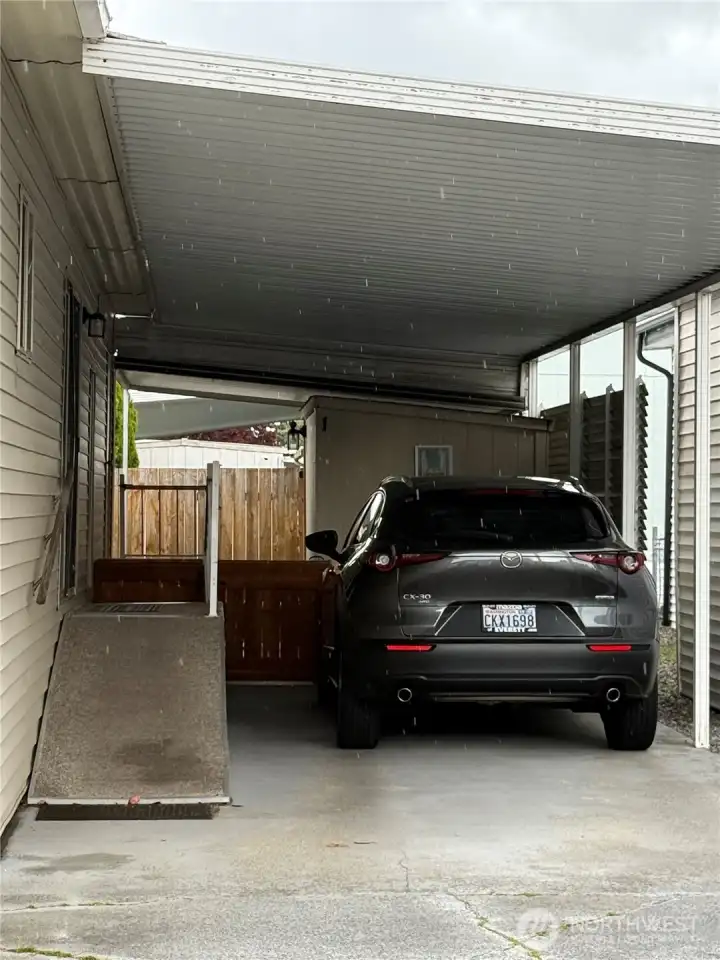 Carport, two storage sheds