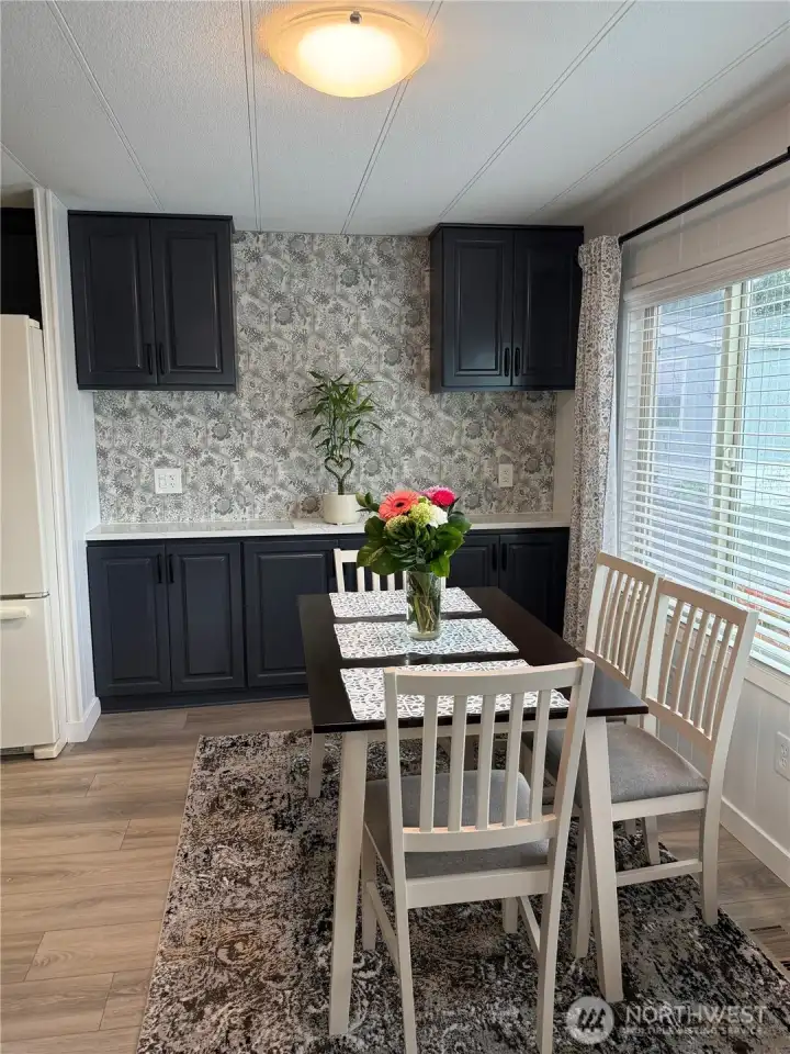 Dining room with tile wall and tile counter buffet