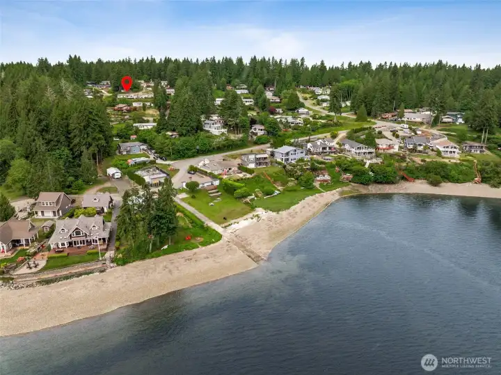 Your new home perched on the hillside looking out into the water. Private community beach!