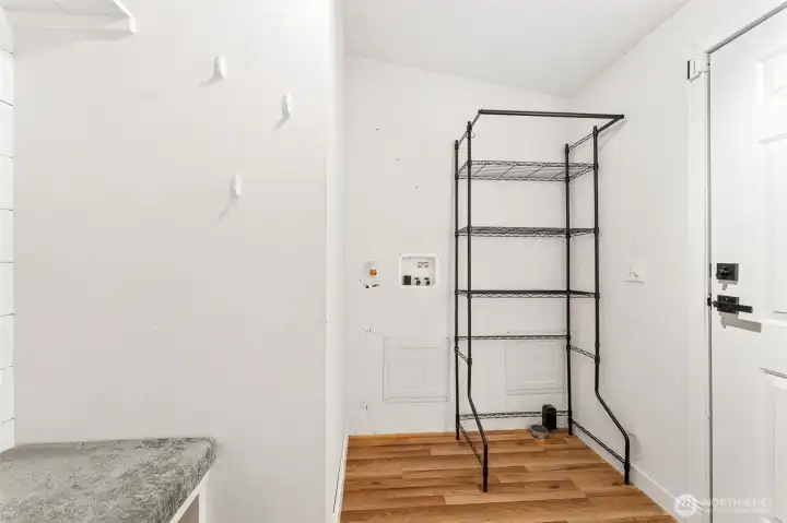 Laundry room / can fit full size w/d right where the rack is.