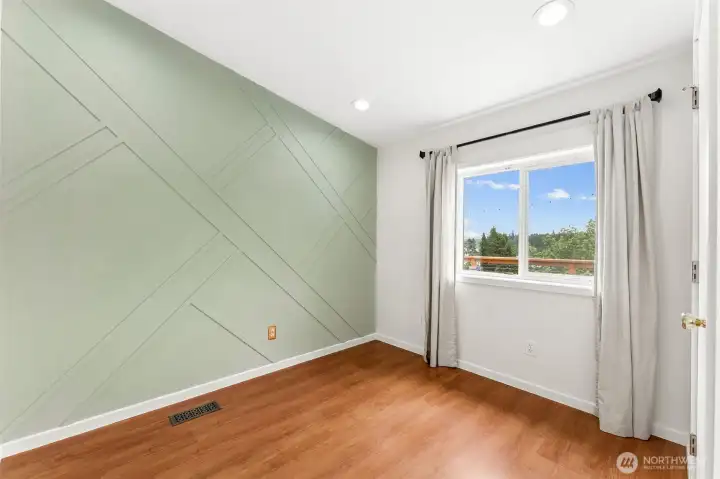 Second bedroom with custom accent wall.