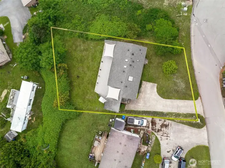 Here in this birds eye view you can see how long the driveway is and how spacious the lot is.