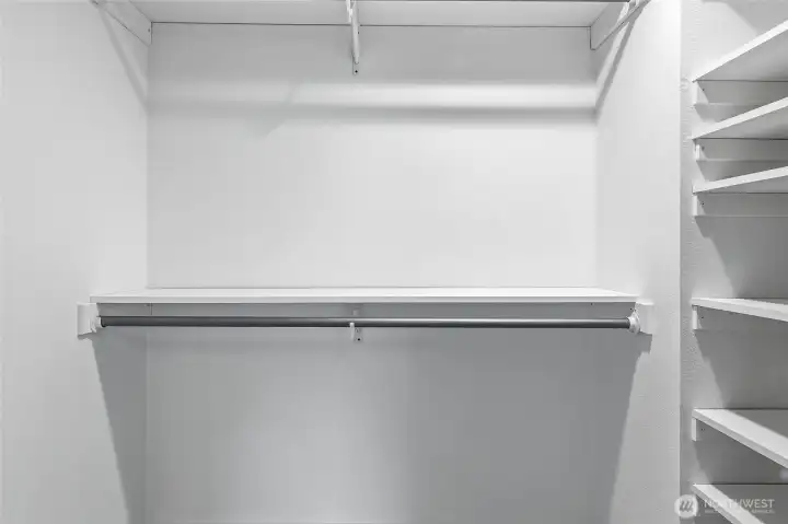 Primary Walk-in Closet provides Generous Wardrobe Space.