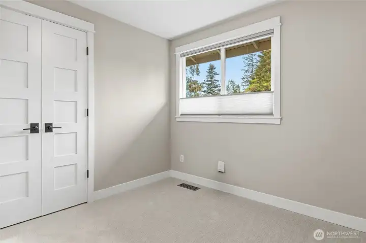 Additional Bedroom features New Plush Carpeting, Big Window Streaming Natural Light, and Custom Blinds.