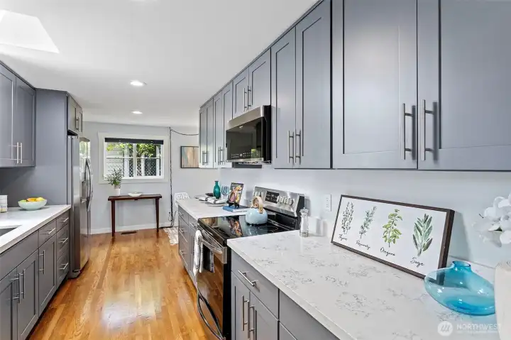 Gray shaker cabinets, quartz counters, stainless appliances. The 2021 kitchen didn't leave anything out.