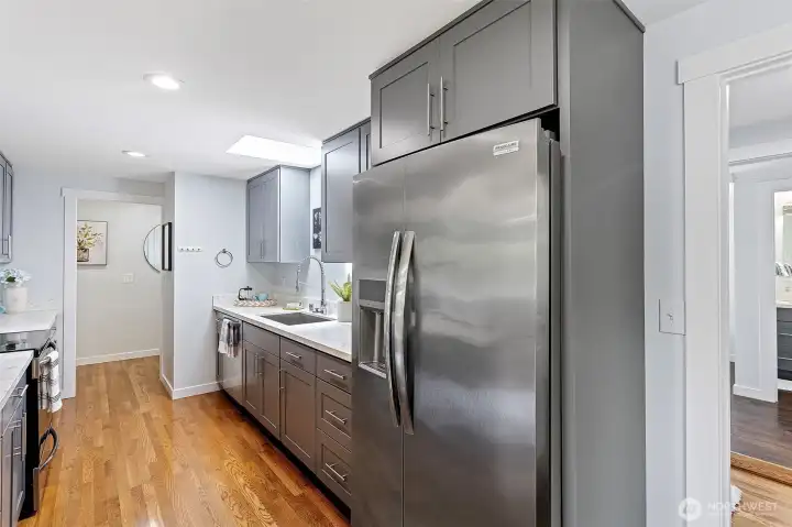 The private bedroom wing is one door away from the kitchen. (The fridge is in between, doing its job.)