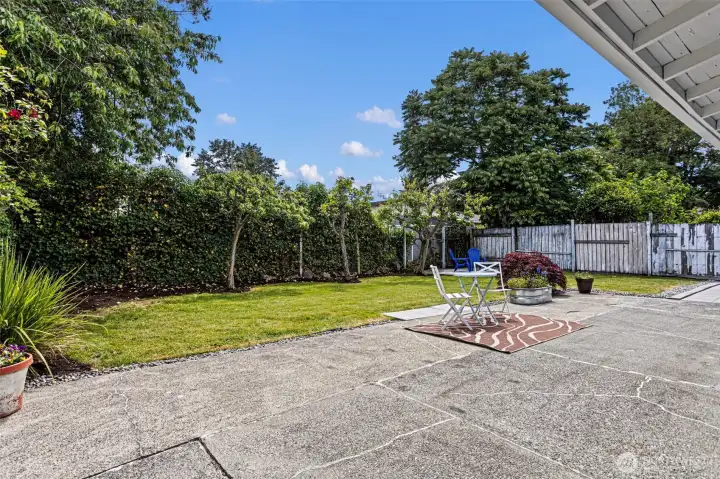 Fenced and private. The patio is bigger than it looks from inside.
