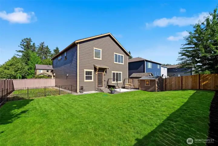 Expansive backyard w/ shed & cherry tree