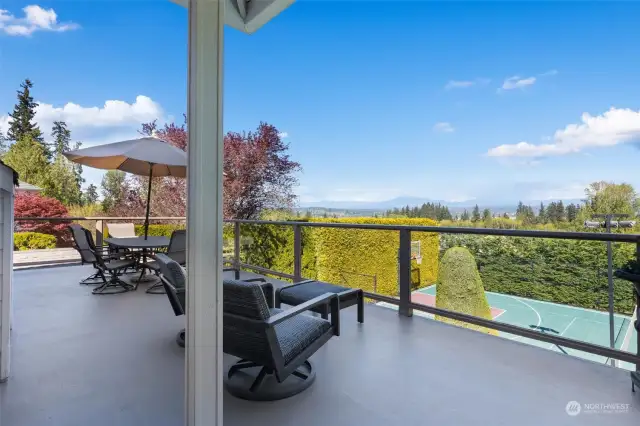Expansive deck shows mountain and valley views along with access to backyard activities!
