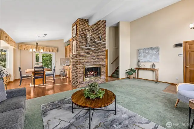 The rustic brick fireplace serves as a stunning centerpiece, adding warmth and character to this room. A comfortable space for entertaining or everyday living.