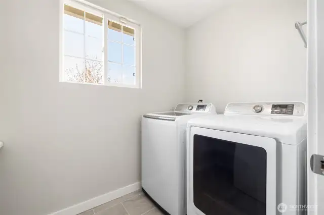Laundry conveniently located in upper level