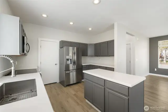 Recently installed cabinets and stainless steel appliances