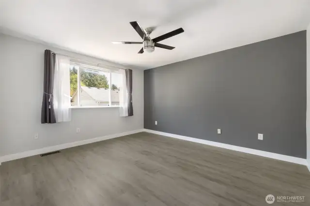 Primary bedroom with remote controlled ceiling fan