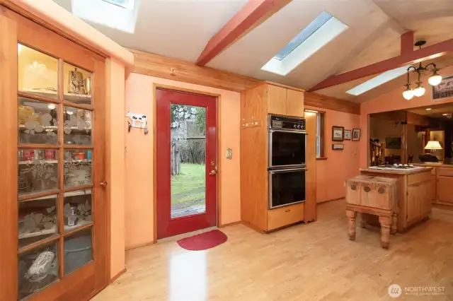 Rear door from informal area, notice glass doors of corner pantry.