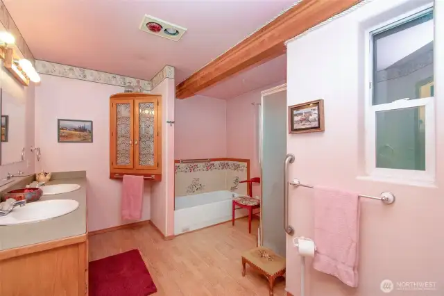 Primary bath, painted tiles around the tub.