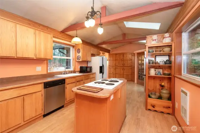 Kitchen with island cooking.