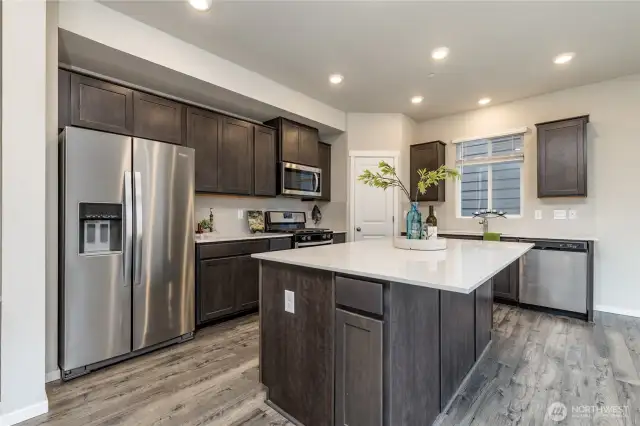Gorgeous kitchen with oversized island and quartz countertops