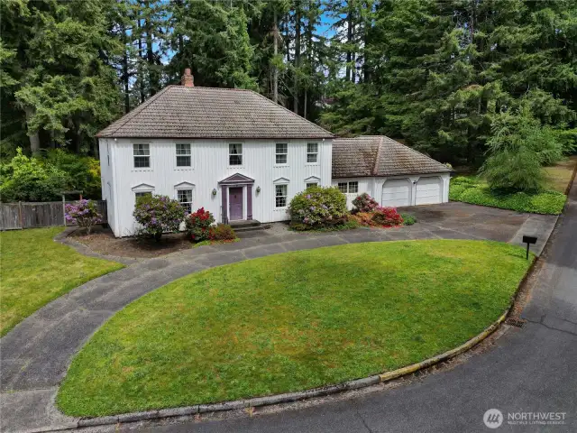 Circular drive and driveway provide convenience and lots of off-street parking.