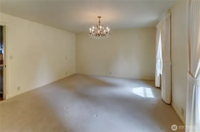 Dining room, door on left leads to kitchen and family room.