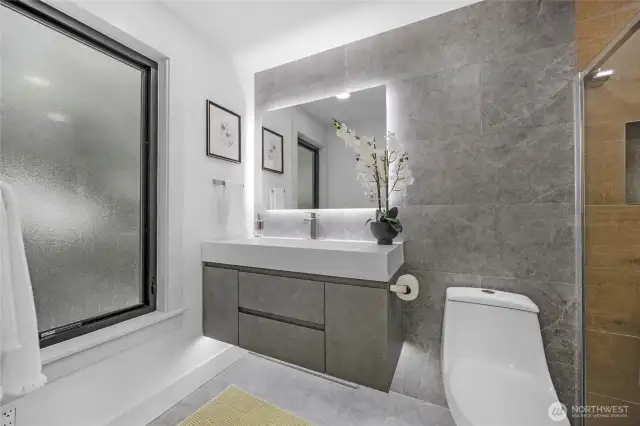 Don't miss the heated floors and smart mirror