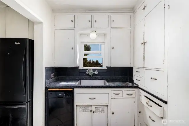 Cozy kitchen has all the necessities.