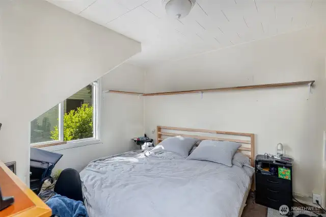 Downstairs bedroom with unique framing.