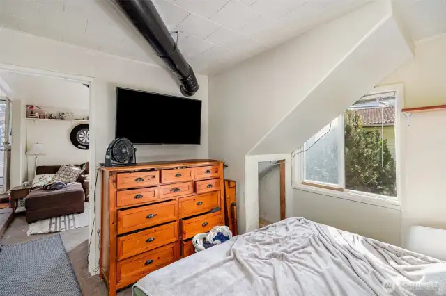 Another view of the downstairs bedroom with creative storage.