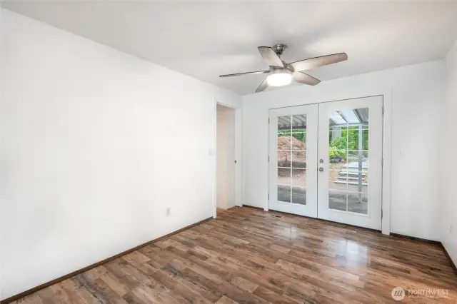 Formal dining area with french doors that lead you to your covered back patio