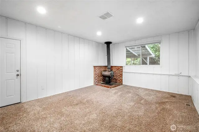 Large bonus room with wood burning fireplace