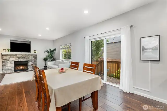Dining and family rooms are part of the great room, as well as a large kitchen, with sliders to the backyard and lots of light from large windows.
