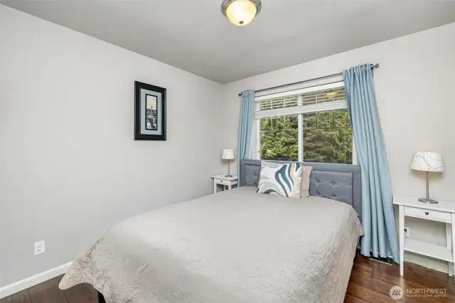 Bedroom across from main bath to the left, with large window facing the front and full closet.