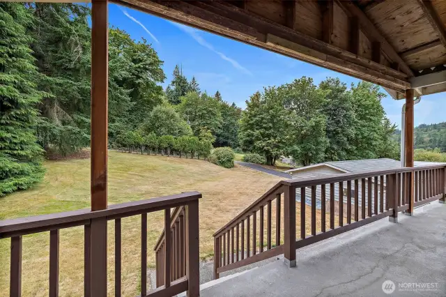 From front porch looking out driveway entrance w/detached 2 car garage off to the side